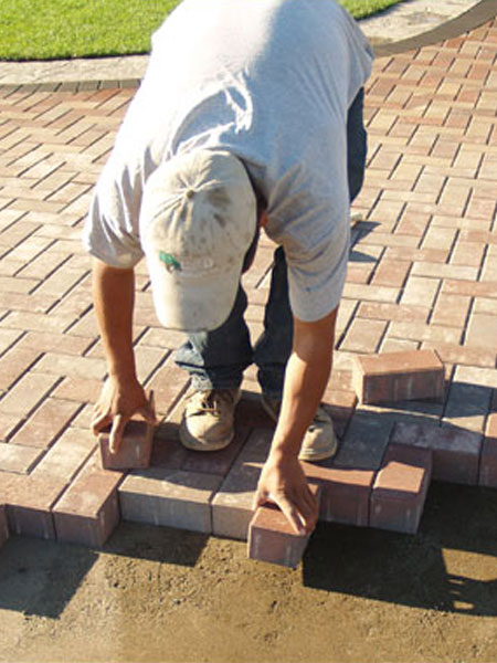 Photo of worker installing pavers in Las Vegas