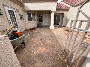 Custom earth-tone paver patio installation with charcoal border in Henderson, NV courtyard by Chicago Landscape of Las Vegas.