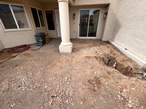 Custom earth-tone paver patio installation with charcoal border in Henderson, NV courtyard by Chicago Landscape of Las Vegas.