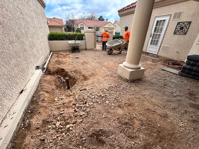 Custom earth-tone paver patio installation with charcoal border in Henderson, NV courtyard by Chicago Landscape of Las Vegas.