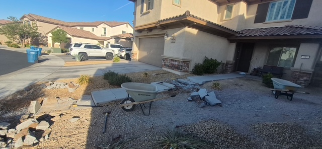 Jackhammer demolition and excavation of old concrete walkway and front porch in Green Valley, Henderson.