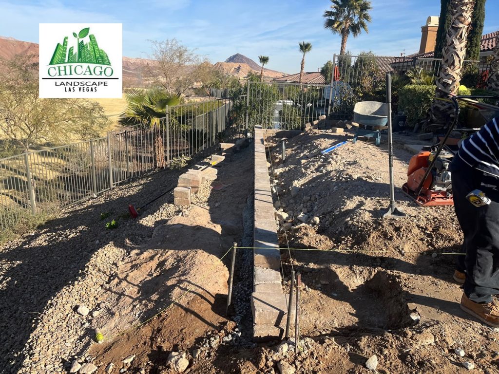 Close-up of retaining wall construction and paver base preparation for a Lake Las Vegas pool deck extension