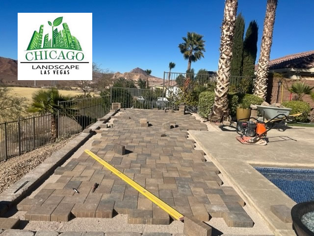 Landscape pavers being installed after fill and retaining walls were completed for a Lake Las Vegas pool deck extension