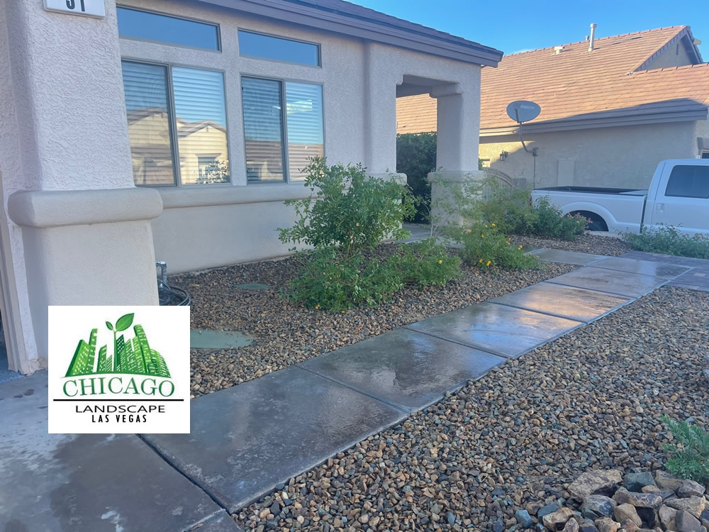 Front entrance landscaping with decorative rock and larger drainage boulders in Henderson, NV.