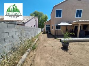 Before photos of a Las Vegas yard redesign showing dead grass and weeds.