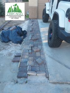 installation of paver accents on left side of driveway
