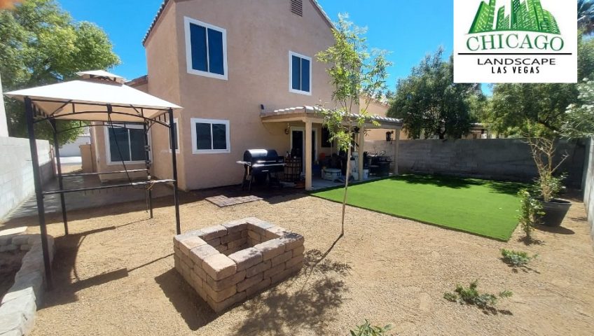 Photo shows custom built fire pit in backyard.