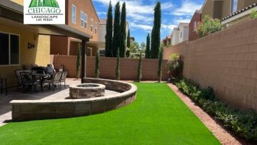 Southern Highlands backyard redesign with artificial turf, a curved decorative wall, and a custom gas fire pit.