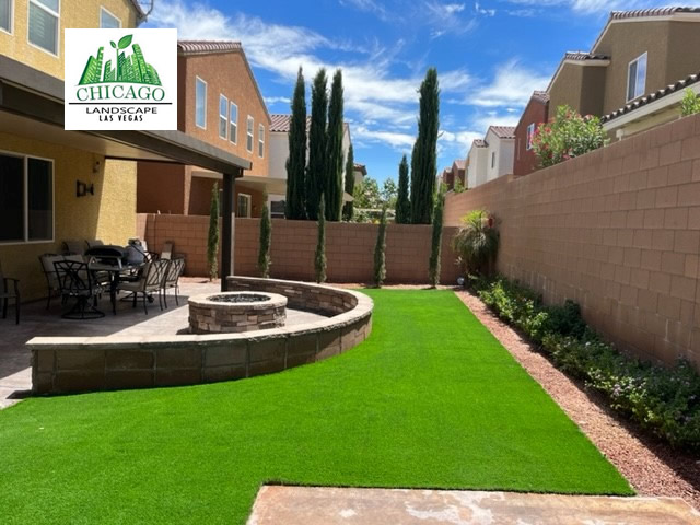 Southern Highlands backyard redesign with artificial turf, a curved decorative wall, and a custom gas fire pit.